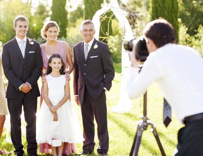 Happy family posing for wedding photography