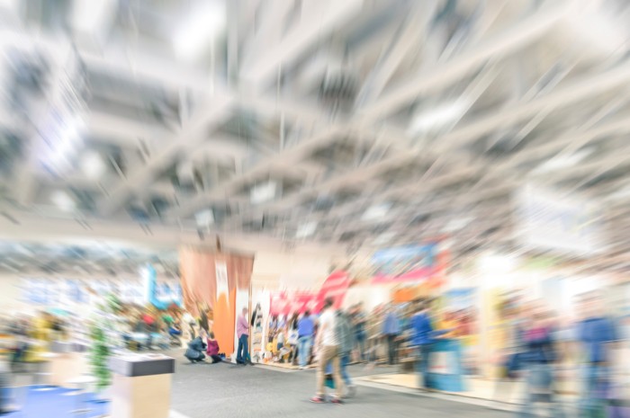 Generic trade show stand with blurred zoom defocusing - Concept of business social gathering for international meeting exchange